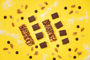 No-Bake Dark Chocolate & Sea Salt Nut Bars On Yellow