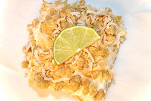 Toasted Coconut Lime Cheesecake Bars with Fresh Lime on top
