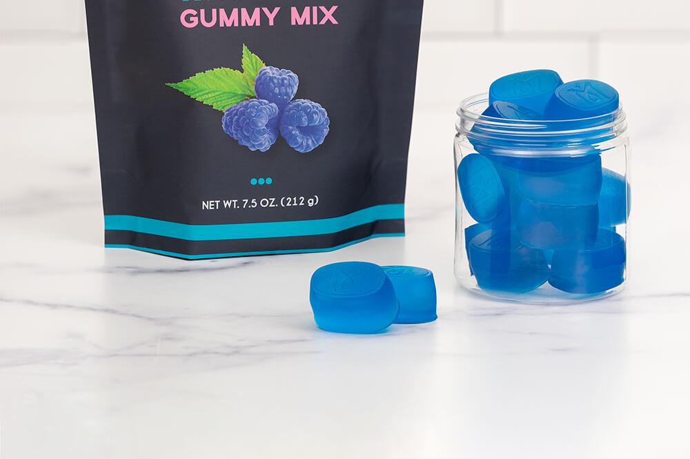 Magical Blue Raspberry Gummy Mix Bag with Gummies on Marble Countertop