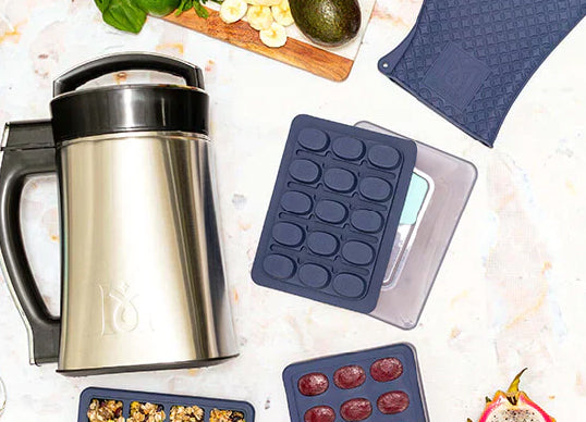 a coffee maker and a box of cookies on a table