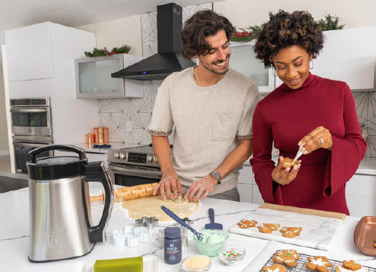 a man and woman cooking in a kitchen